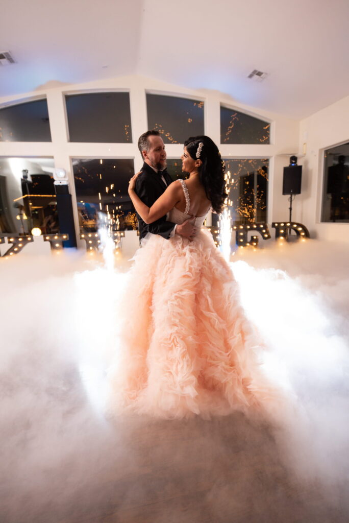 Bride and groom first dance with fog effect in Terrace Room Las Vegas wedding venue