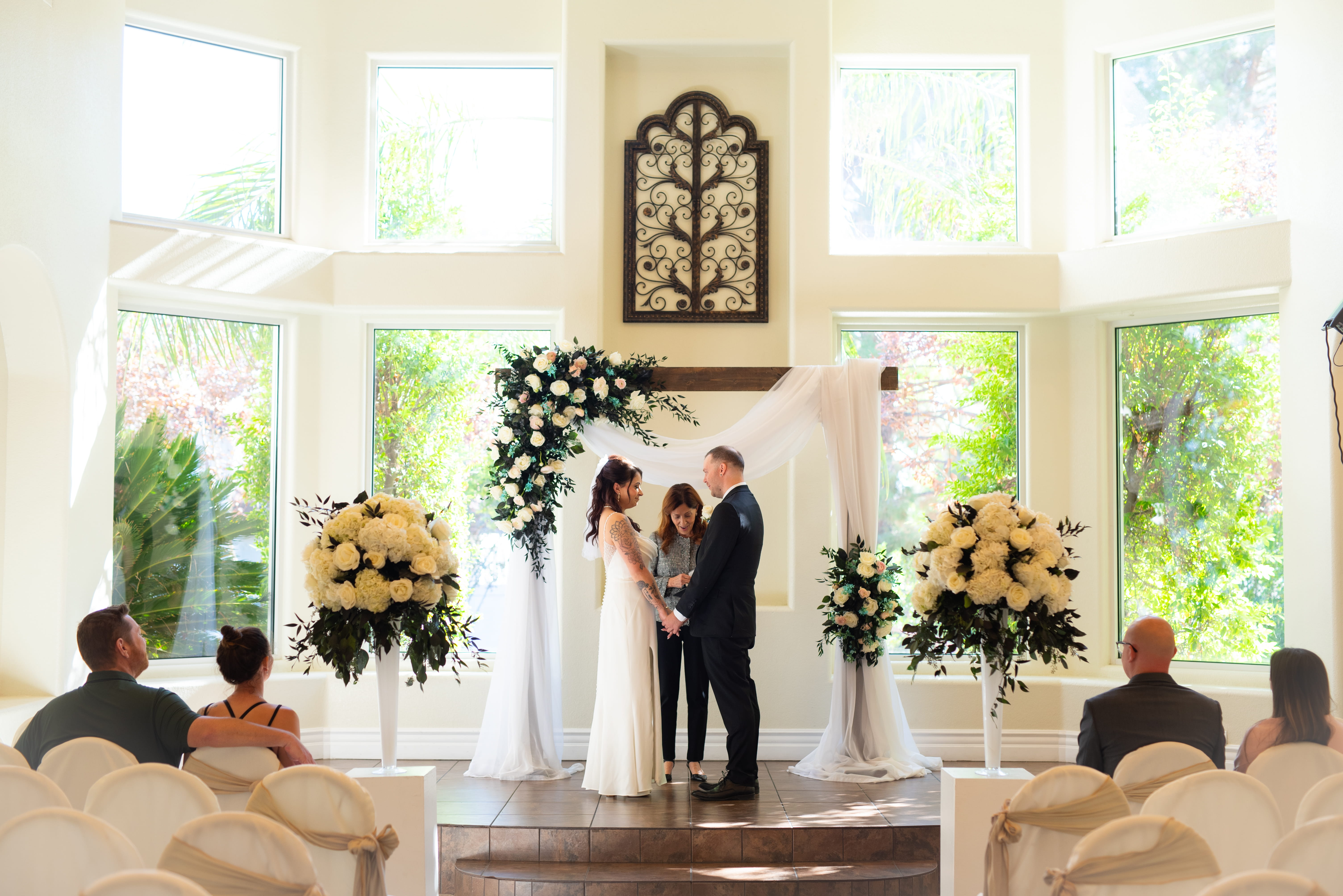 wedding ceremony in Las Vegas chapel with couple at altar and guests seated