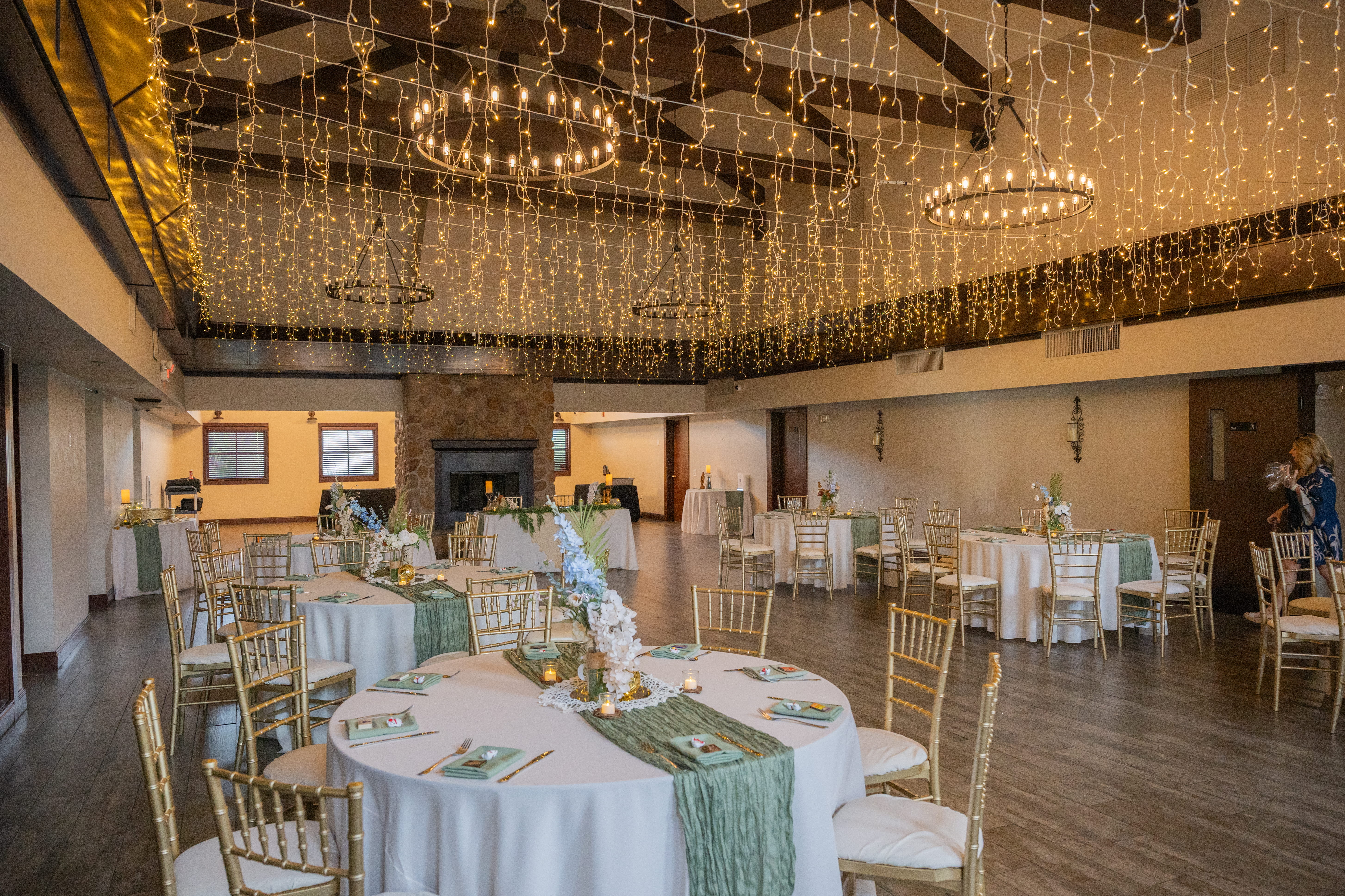Las Vegas banquet hall wedding reception with string lights, decorated tables, and large event space