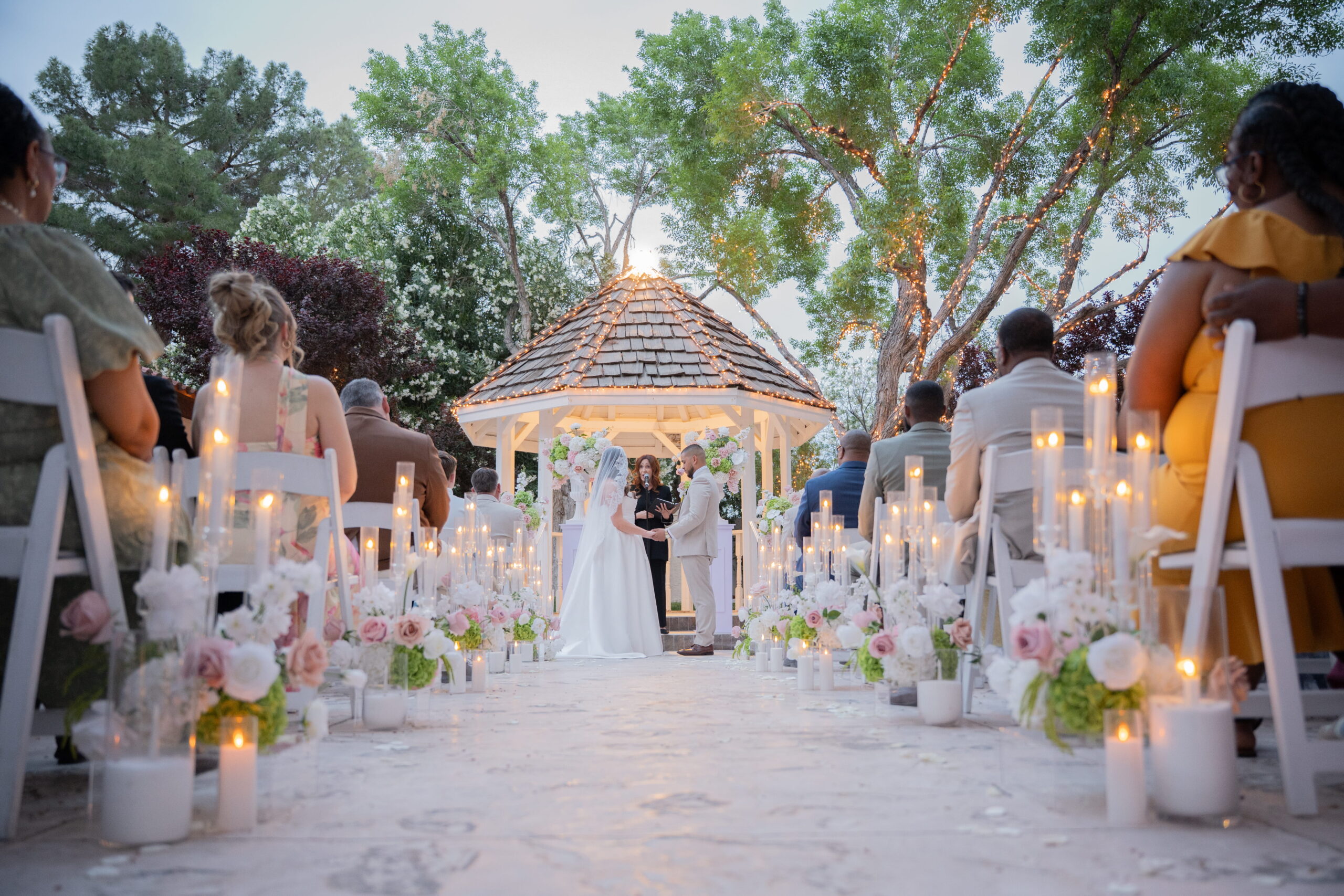 Romantic outdoor ceremony aisle with candles and gazebo in Las Vegas wedding venue