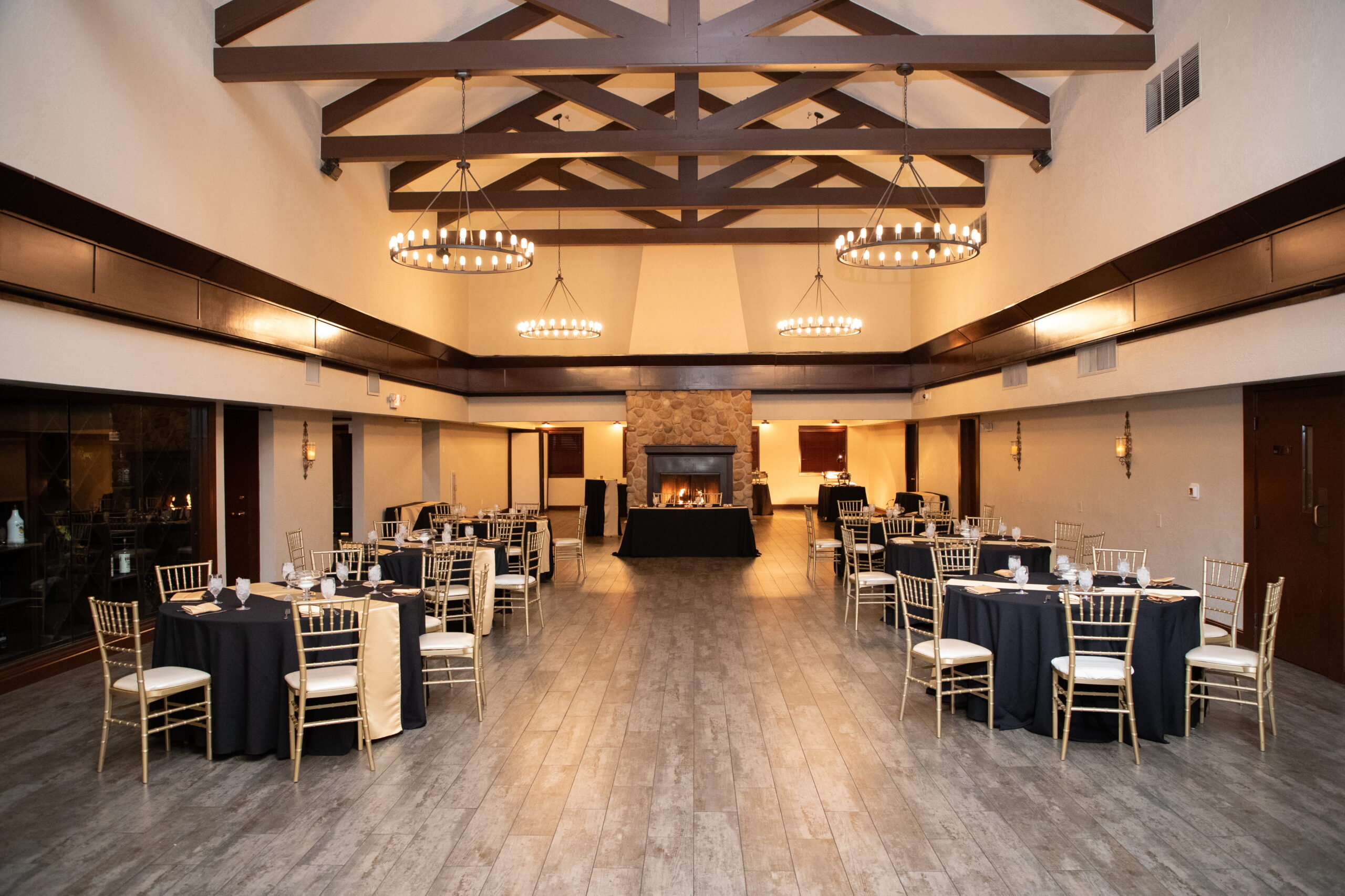 Las Vegas banquet hall interior with stone fireplace centerpiece and neatly arranged dining tables