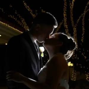 Happy newlyweds kissing celebrating in the garden courtyard of our Las Vegas wedding venue with all-inclusive packages